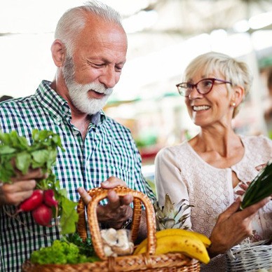 Couple buying vegetables at a farmer’s market