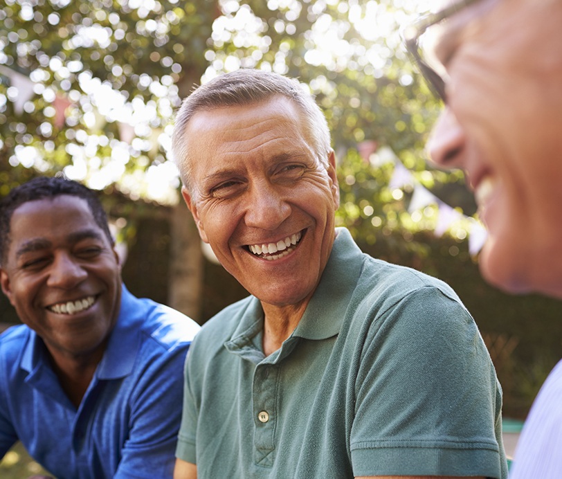 Group of friends smiling together outdoors