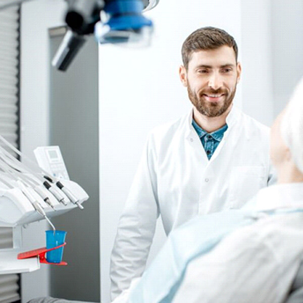 dentist and senior patient having a conversation