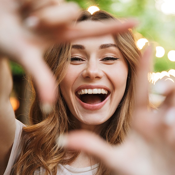 Woman sharing flawless smile after gum recontouring