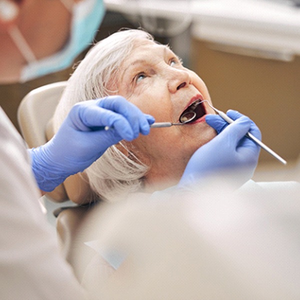 Woman seeing dentist in Hingham