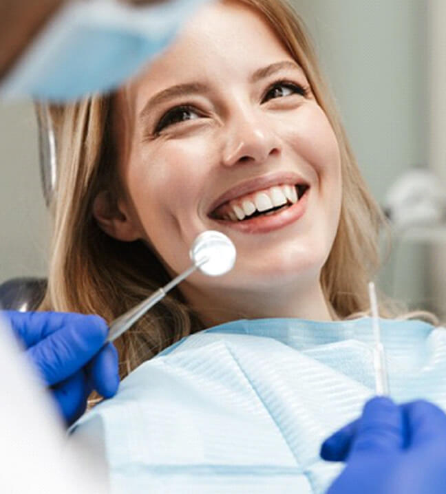 lady smiles at dentist