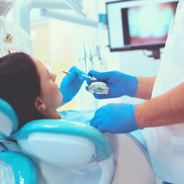 dentist treats patient