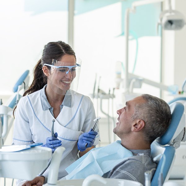Dentist discussing dentures in Hingham with a patient