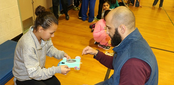 Doctor Hegazi talking to child