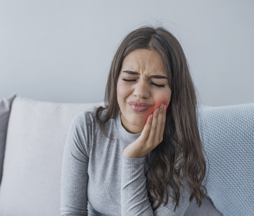 Woman in pain before emergency dentistry