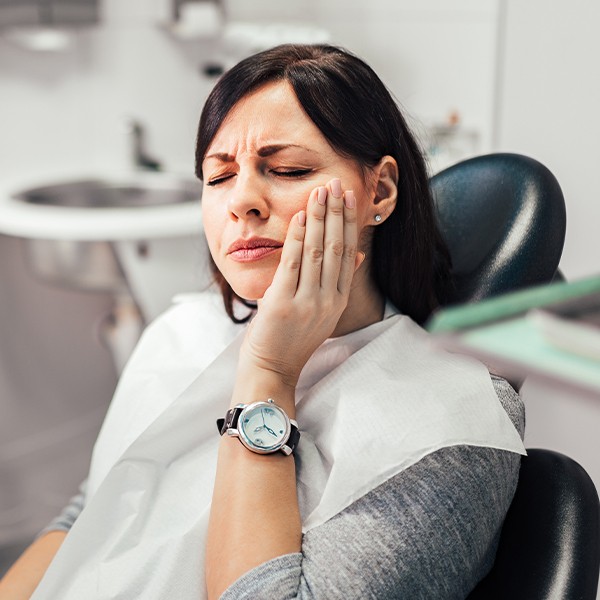 Woman in pain before tooth extraction
