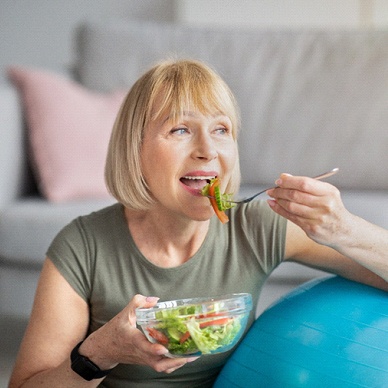 older woman eating healthy food