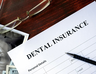 Dental insurance paperwork for the cost of dental implants in Hingham