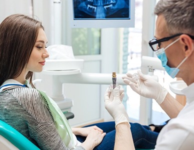 a patient learning about how dental implants work