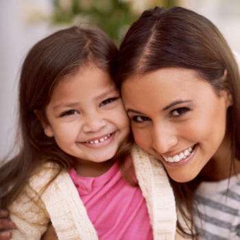 Mother and child smiling after visiting the children's dentist