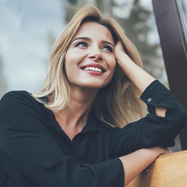 Woman smiling outdoors