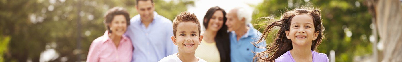 Family smiling together after visiting their dentist near Weymouth Massachusetts