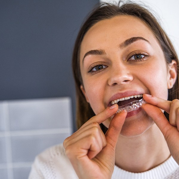 woman putting in PerioProtect tray 