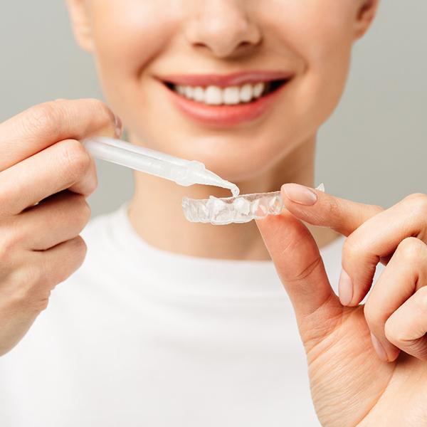 woman preparing PerioProtect tray 