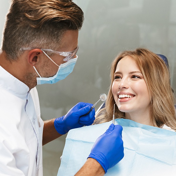 Woman receiving scaling and root planing treatment