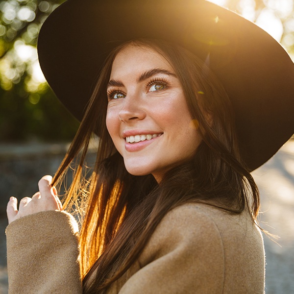 Woman with healthy smile after fluoride treatment