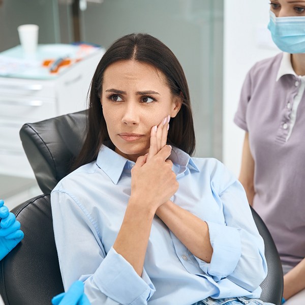 A woman with a painful toothache 