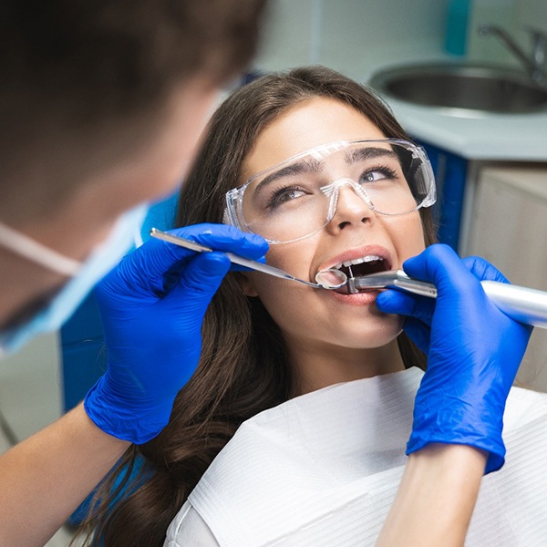 Woman in dental chair undergoing root canal