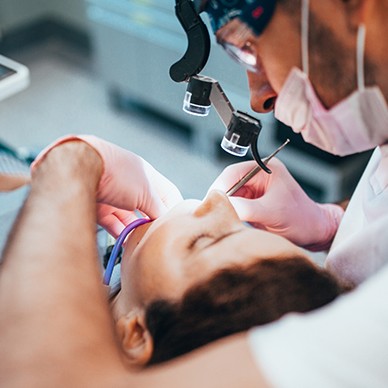 Dentist performing procedure on patient
