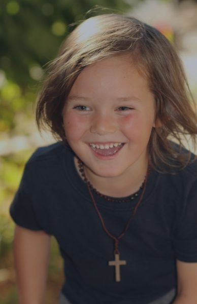 Child smiling after visiting the children's dentist