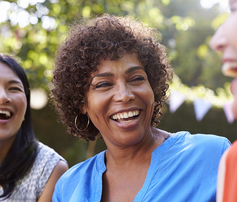 Woman sharing healthy smile with friends