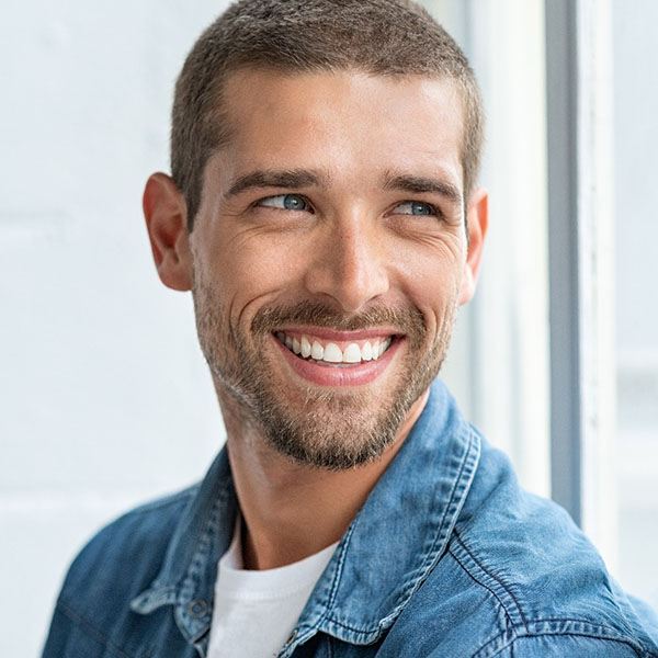 man smiling with veneers in Hingham 