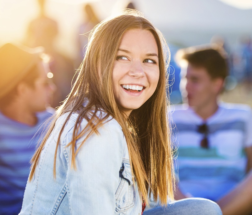 Young woman sharing smile after wisdom tooth extractions